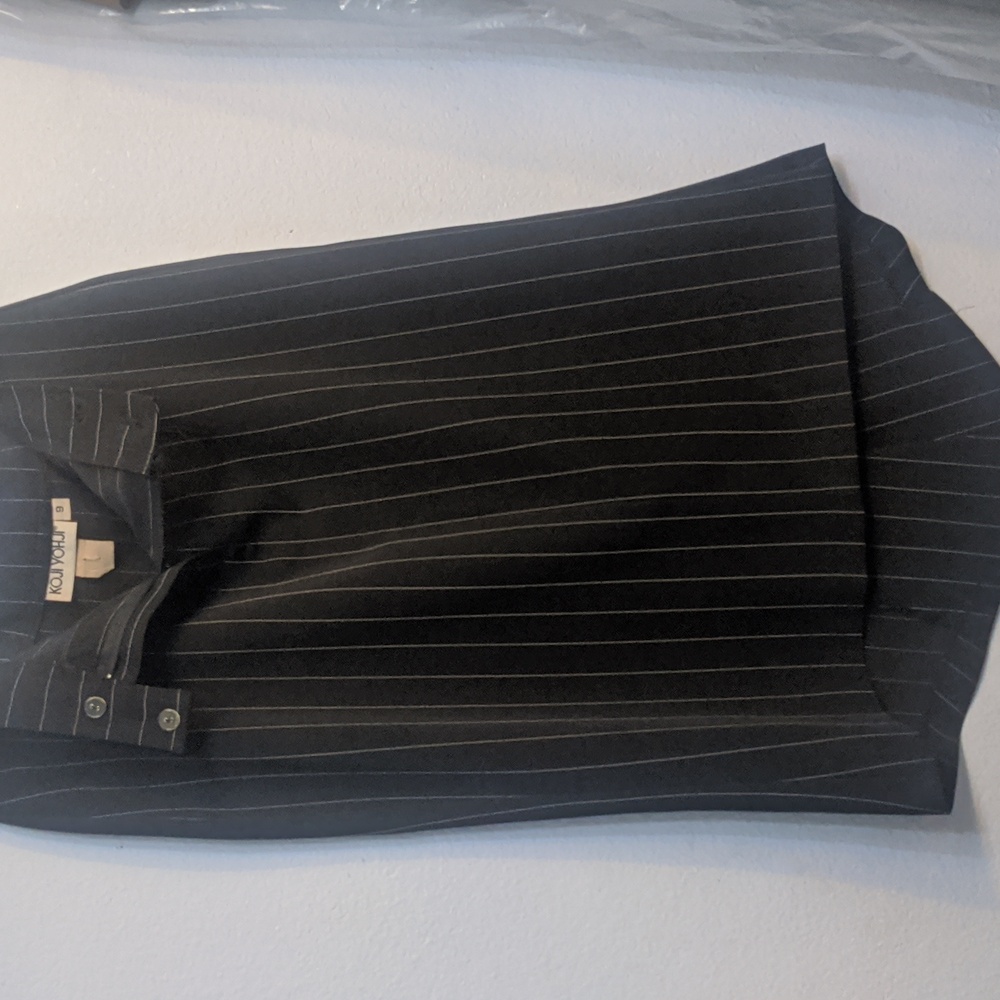 Vintage black size 9 pinstripe knee-high skirt by Koji Yohji backsprit